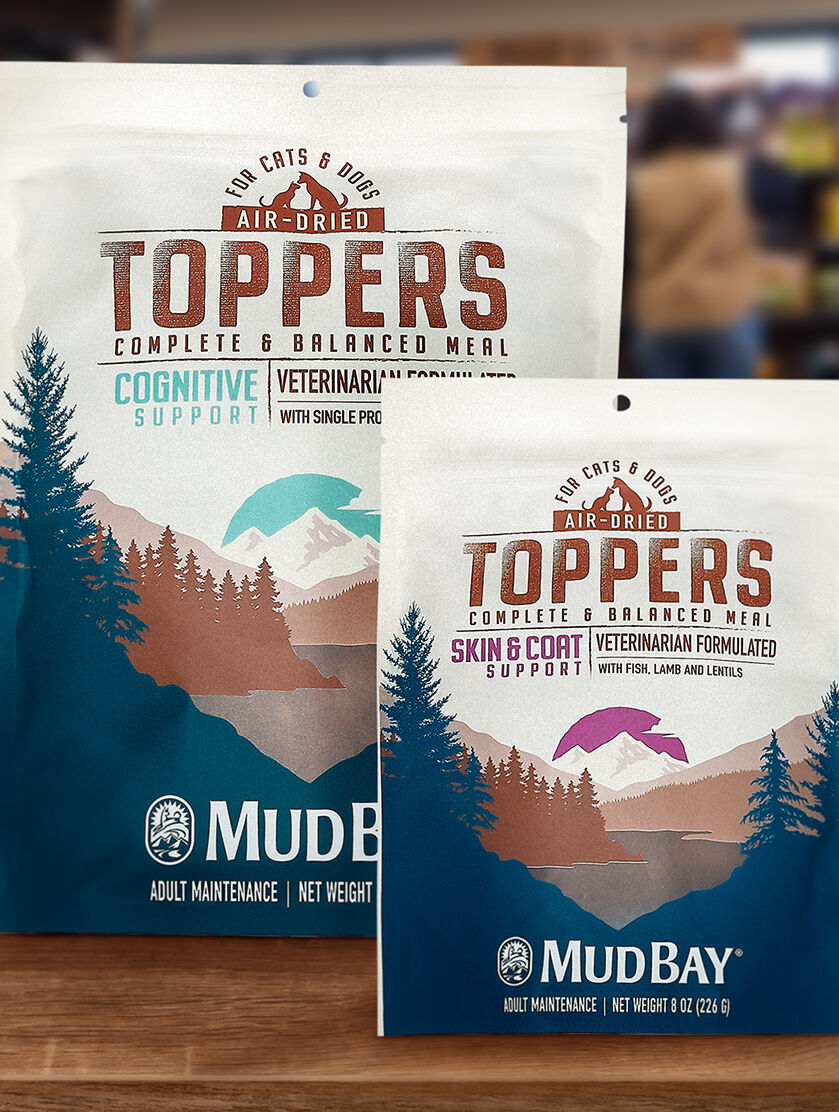 two bags of the new Mud Bay Food Toppers